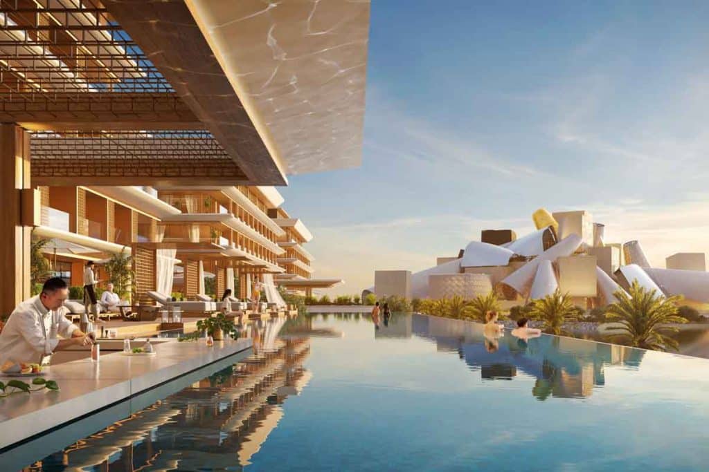 Sunset exterior view of the beachfront residential towers at Nobu Residences within the Saadiyat Cultural District, Abu Dhabi.
